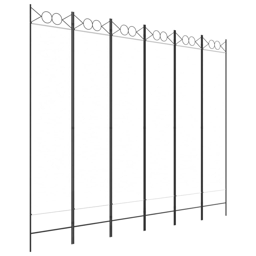 A black metal garden screen or trellis with decorative circles at the top.