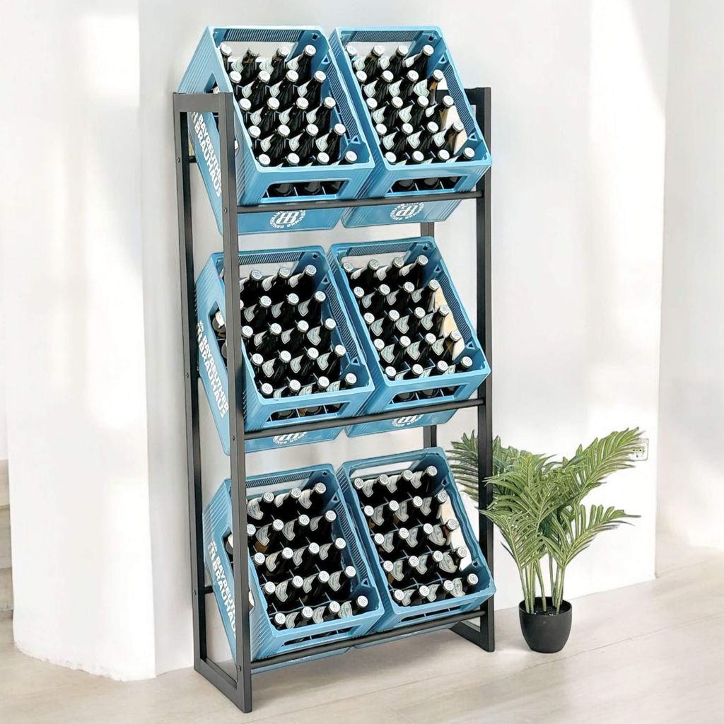 A metal shelving unit filled with blue crates containing bottles, standing against a wall with a plant to the side.