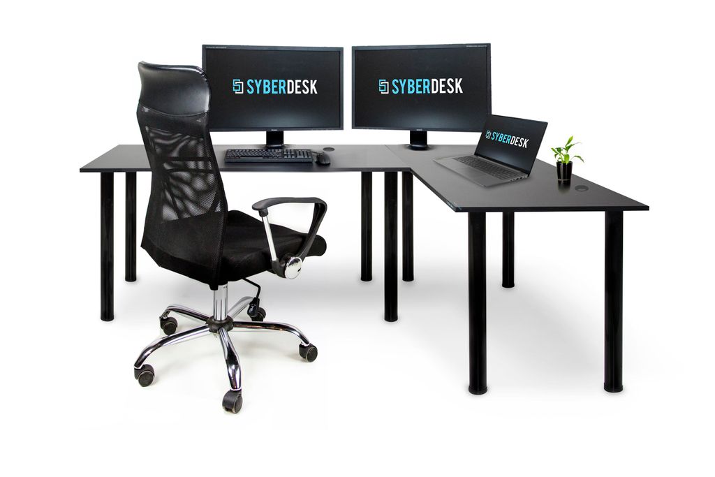 A black L-shaped desk with two monitors, a laptop, a keyboard, a mouse, and a black office chair, all on a white background.