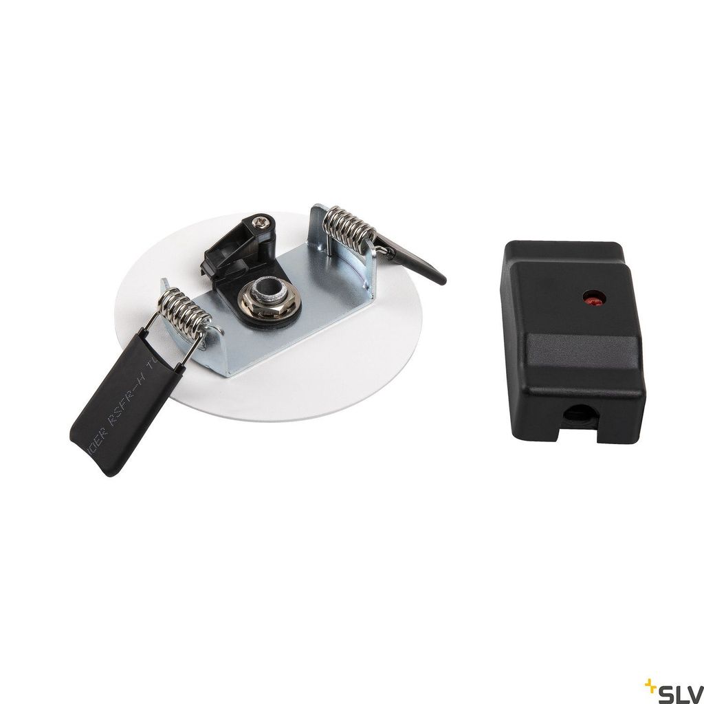 A white circular mounting plate with two spring-loaded clips and a black connector piece are shown on a white background. A separate black rectangular connector is to the right.