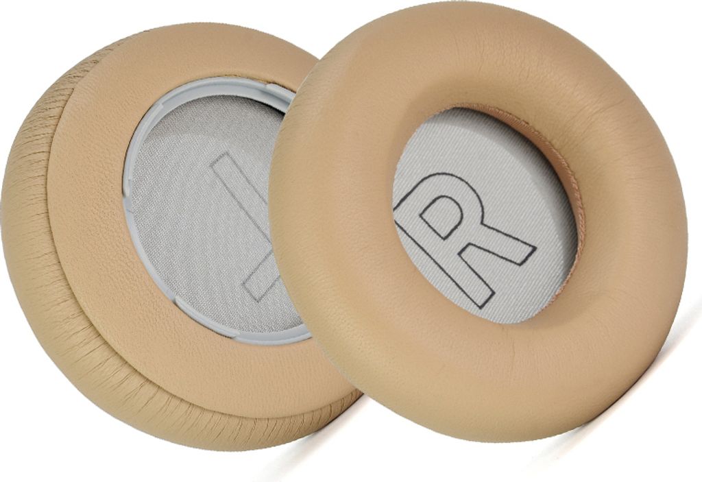 Two beige ear pads for headphones are shown against a white background.