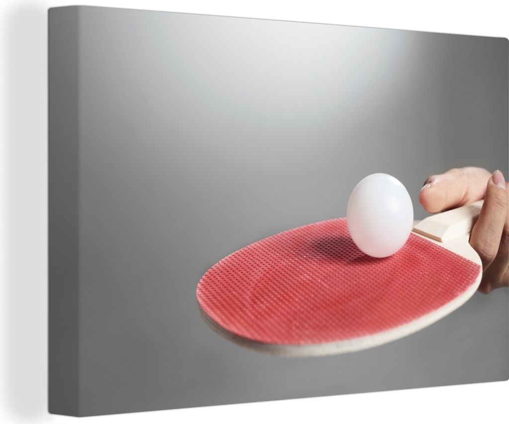 OneMillionCanvasses - Leinwandbilder - 140x90 cm, Hand mit Tischtennisschläger und Ball auf grauem Hintergrund, Wandbilder Kunstdruck Wanddekora...