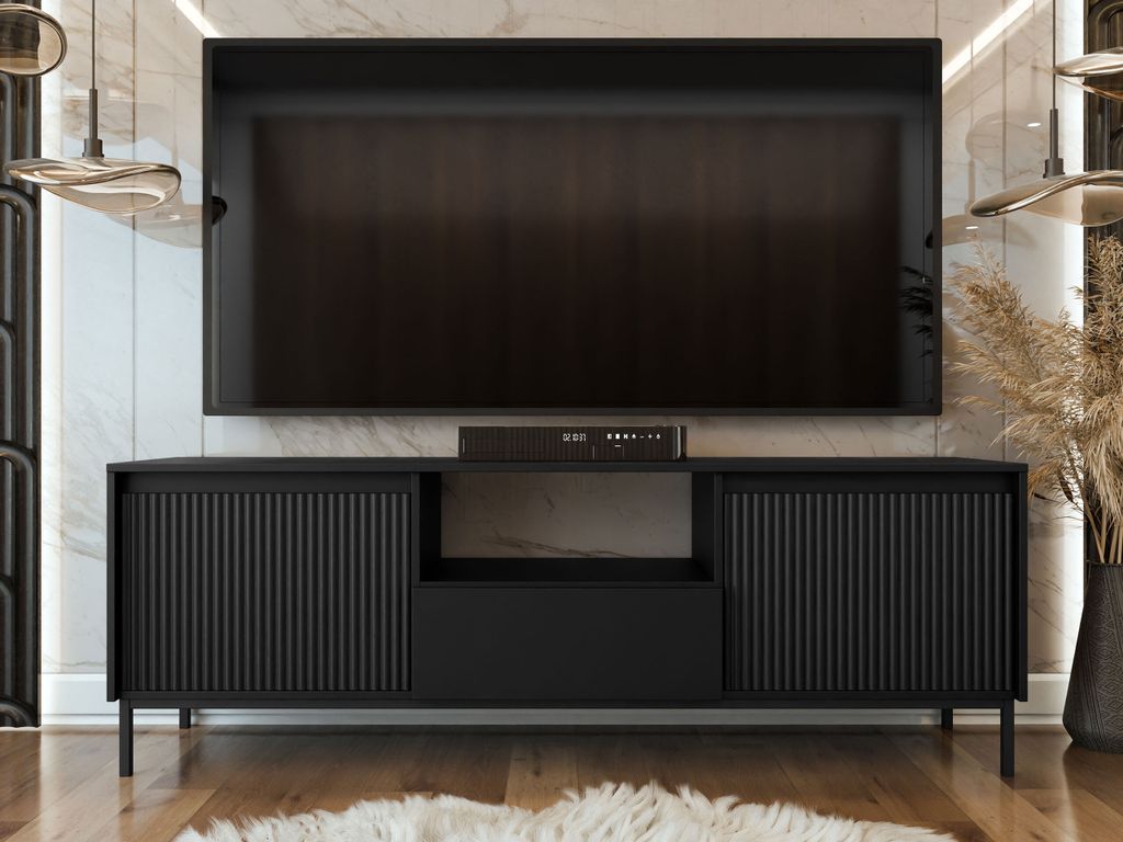A modern living room featuring a black media console with a TV mounted above it.