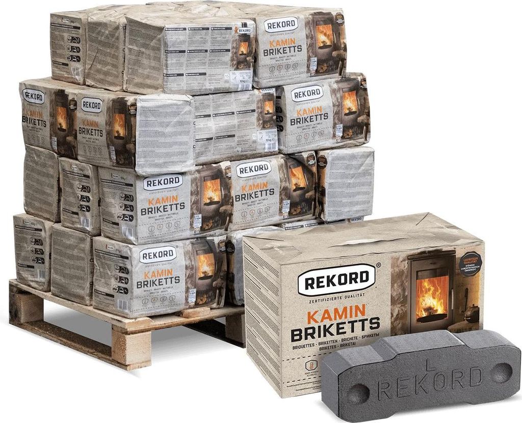 A pallet stacked with packages of Rekord Kamin Briketts, with a single briquette and a box in the foreground.