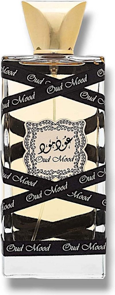 A perfume bottle with a gold cap and black ribbon wrapping around it with the text "Oud Mood" printed on it.