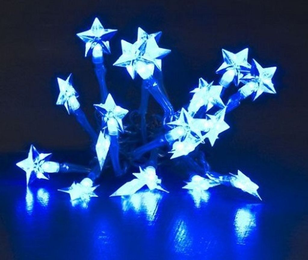 A close-up shot of a string of blue LED star-shaped lights.