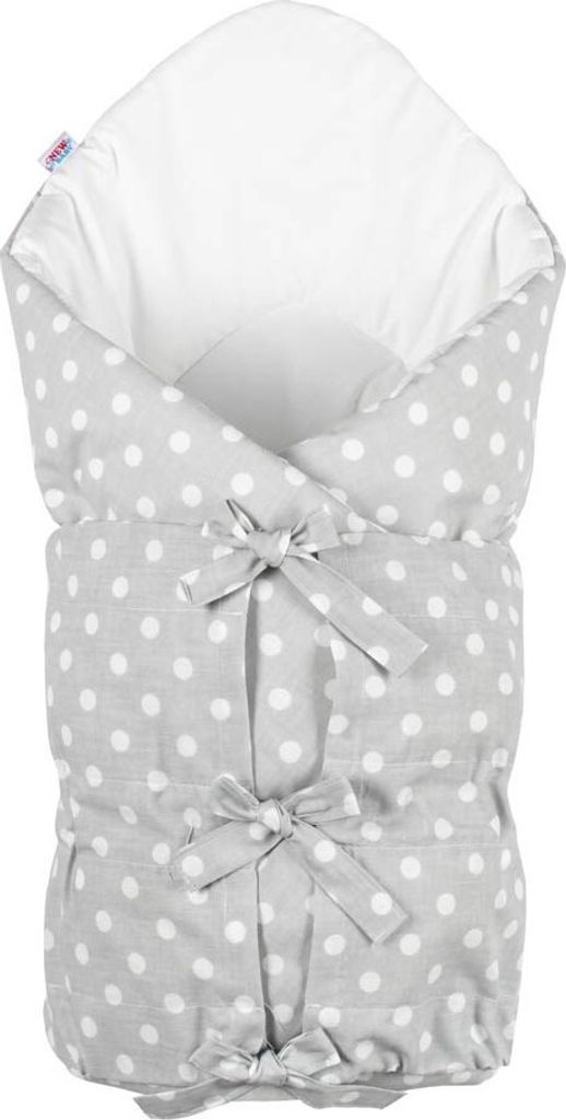 A baby swaddle with a polka dot pattern.