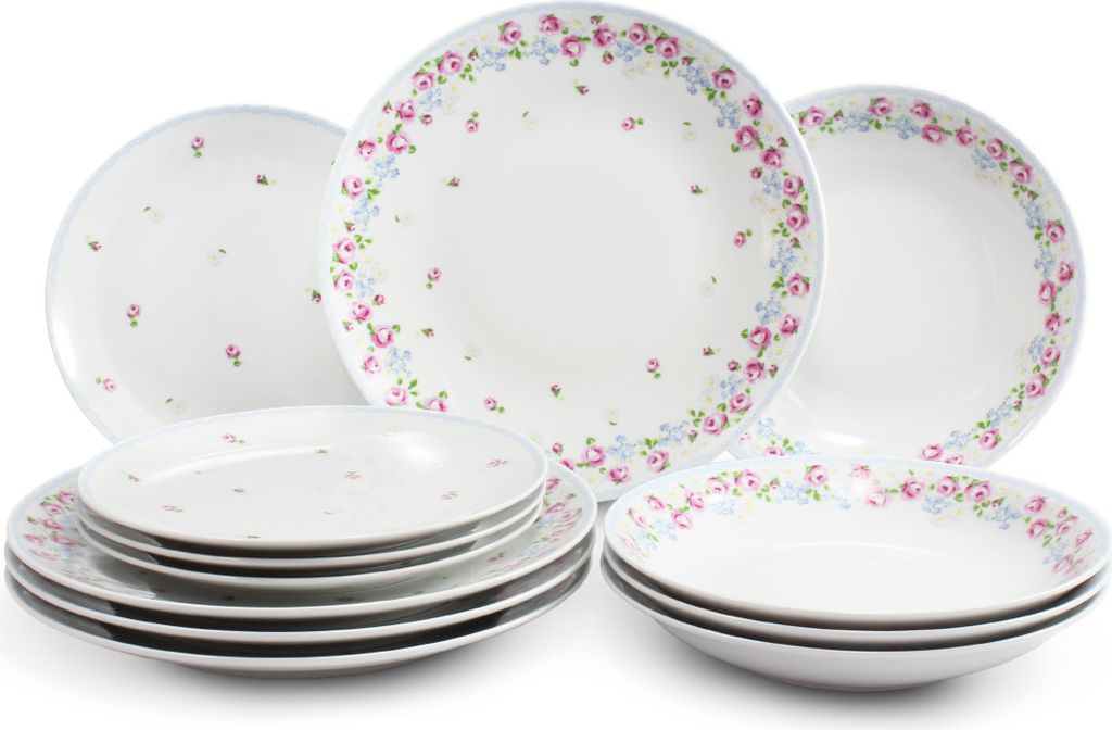 A collection of white ceramic plates and bowls with a floral pattern.