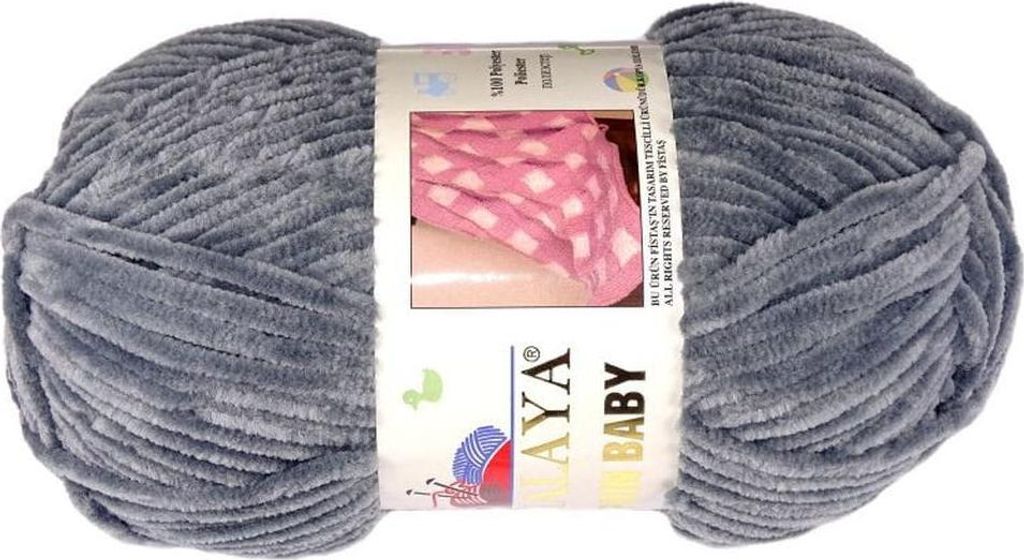 A ball of grey yarn with a product label.