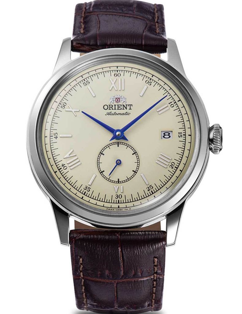 A close-up studio shot of a men's wristwatch with a brown leather strap.
