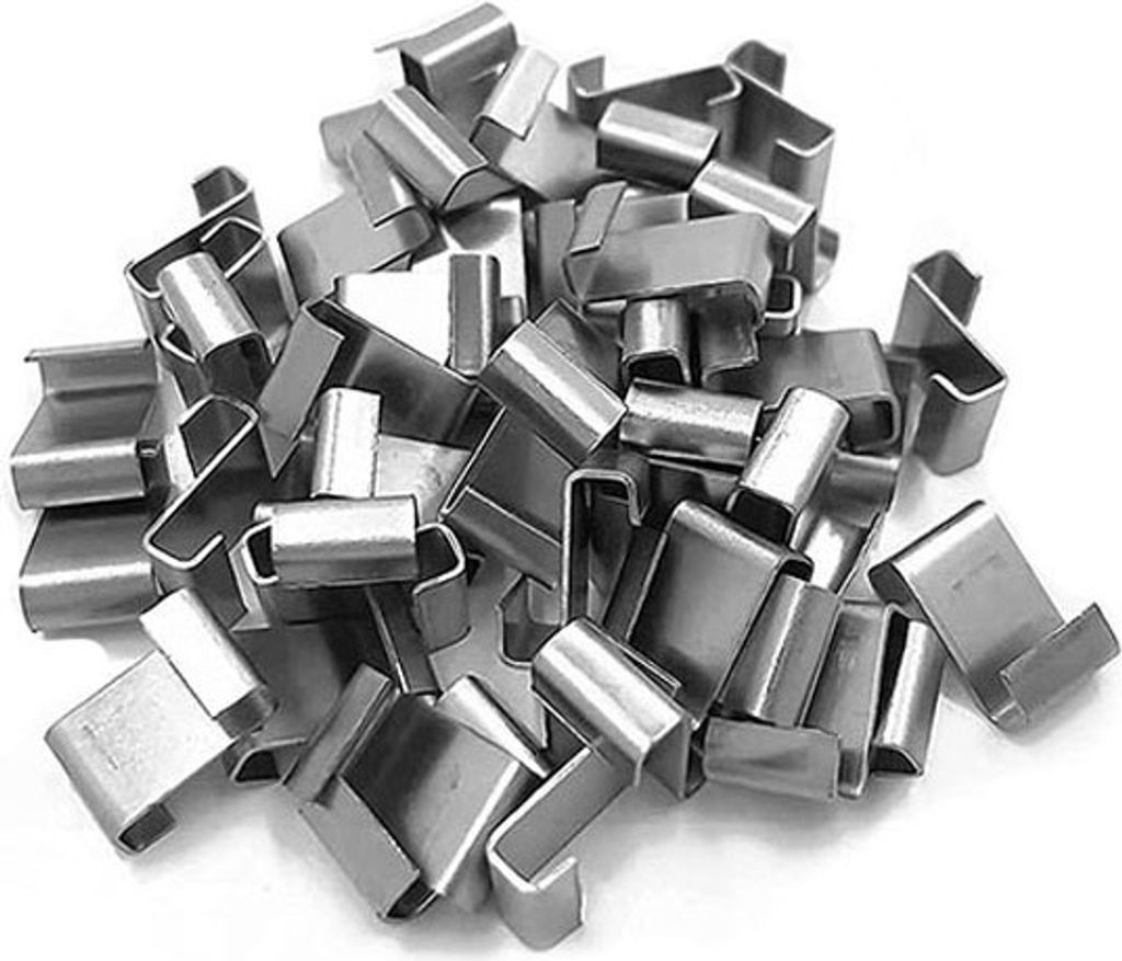 A pile of metal clips on a white background.