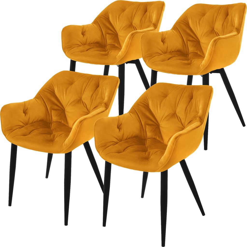 Four yellow velvet dining chairs with black legs are arranged on a white background.
