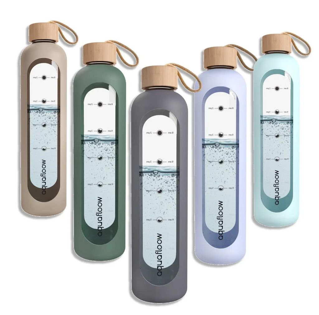 A group of five glass water bottles in different colors, each with a silicone sleeve and a bamboo lid. The bottles have measurement markings and a water level indicator.