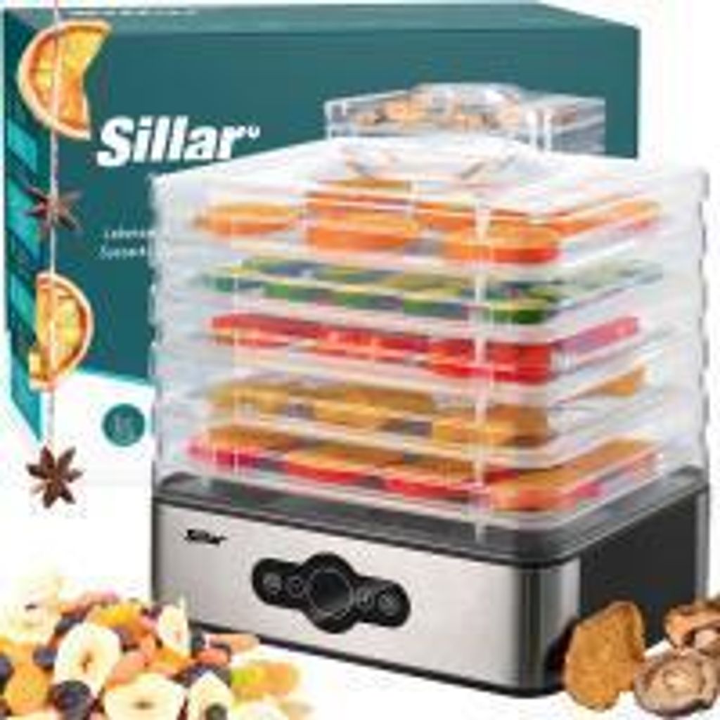 A Sillar food dehydrator with multiple trays filled with dried fruits and vegetables, shown with its packaging and some raw ingredients.