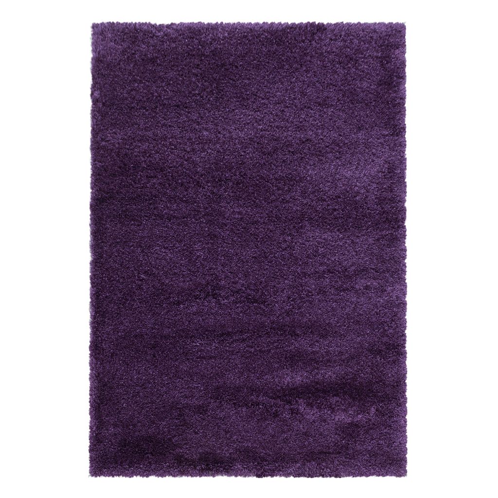 A fluffy, shaggy rug with a high pile, presented in a rectangular shape and a vibrant purple color.