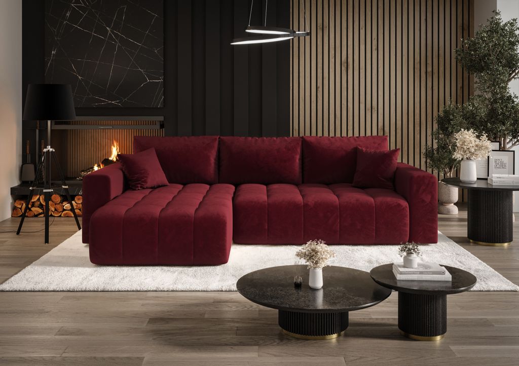 A modern living room with a large red sectional sofa, coffee tables, and a fireplace.