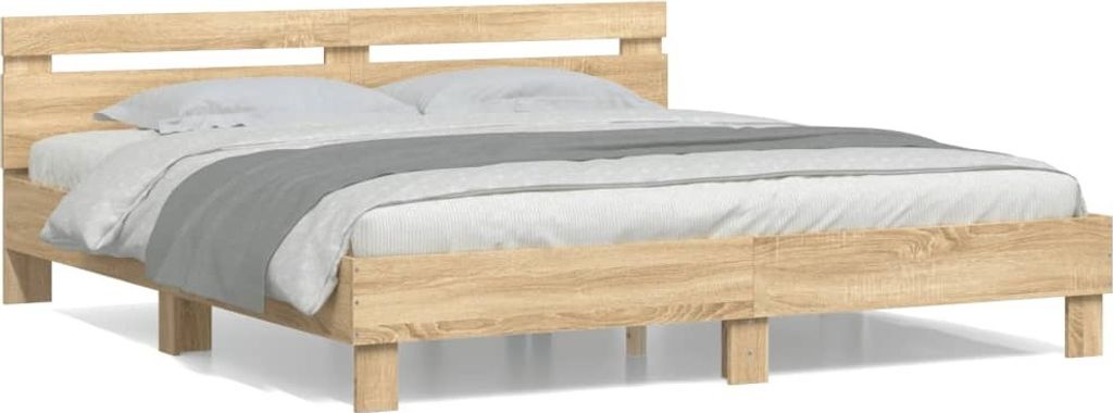 A wooden bed frame with a headboard and bedding, shown against a white background.