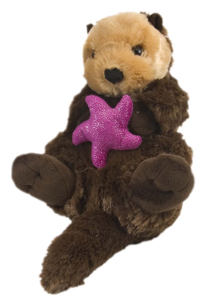 A plush toy sea otter holding a pink starfish.