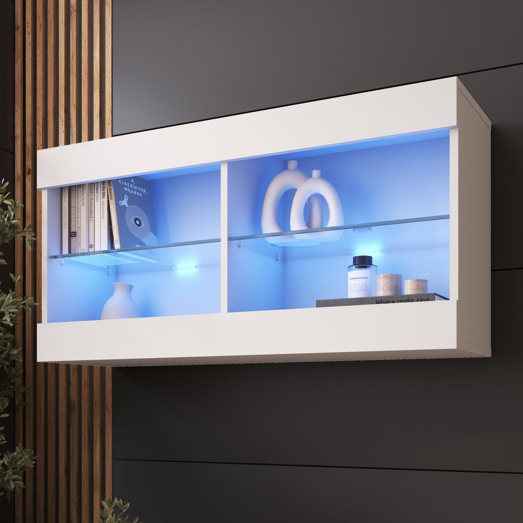 A white wall-mounted cabinet with glass shelves and blue LED lighting, displaying decorative items and books.