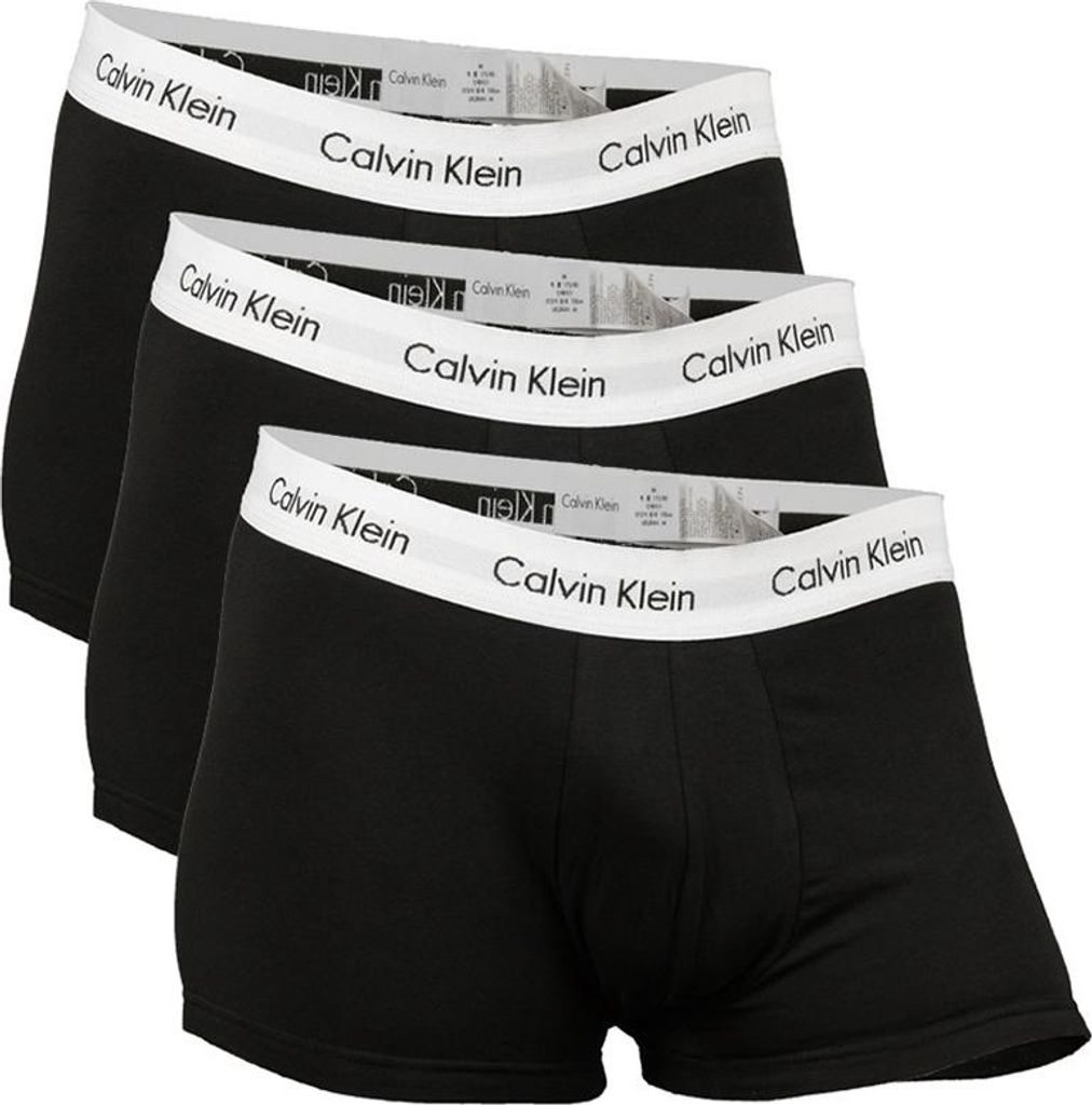 Three black Calvin Klein boxer briefs are stacked on top of each other.