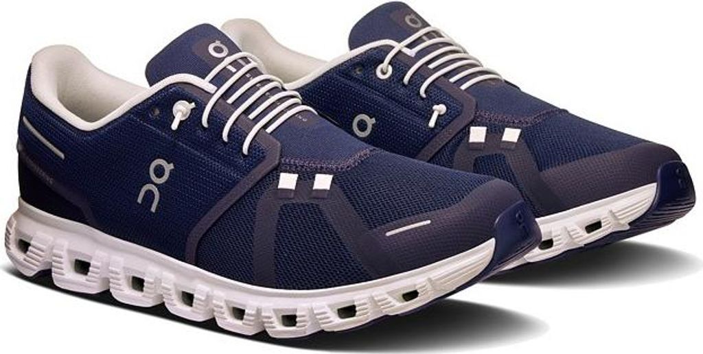 A pair of blue running shoes on a white background.