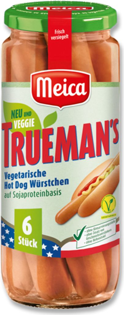 A glass jar filled with vegetarian hot dog sausages, with a label showing product information and branding.