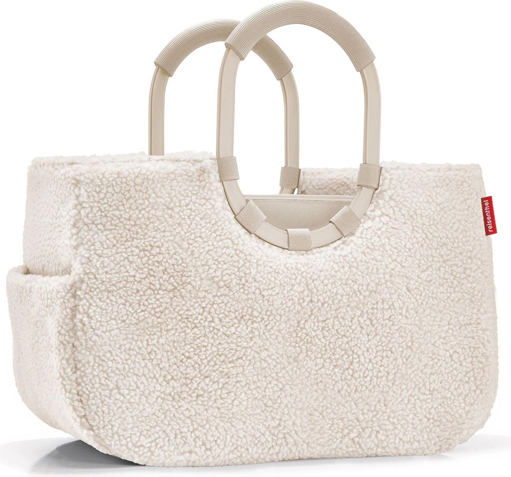 A fluffy cream-colored tote bag with beige handles, shown against a white background.