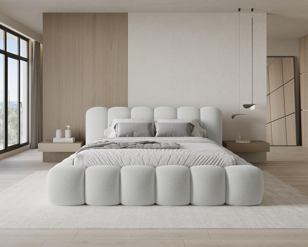 A modern bedroom with a large bed.
