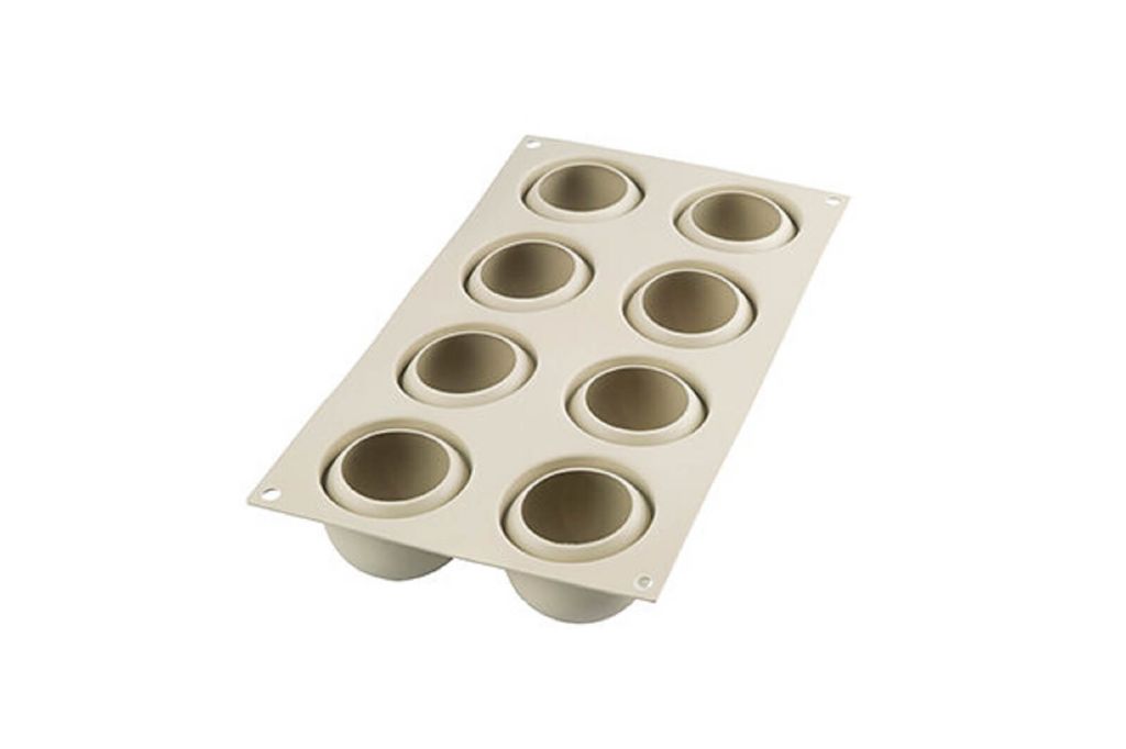 A silicone baking mold with multiple circular cavities.