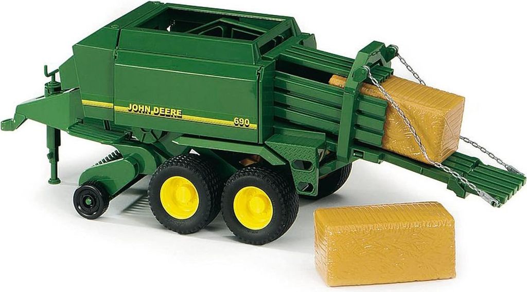A green John Deere large square baler toy with two hay bales, one in the baler and one beside it.