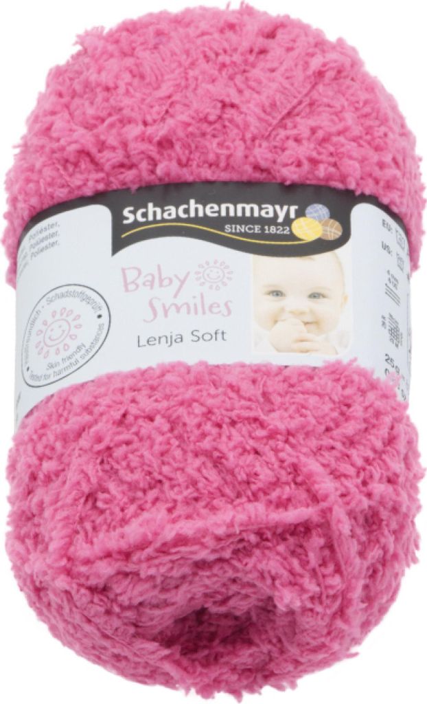 A ball of pink yarn with a label showing the brand and product name.