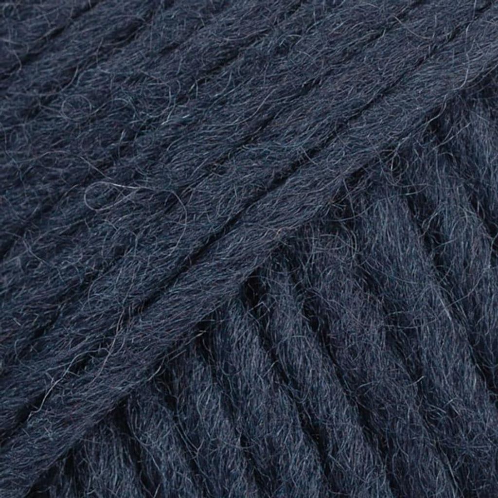 A close-up view of dark blue wool yarn.