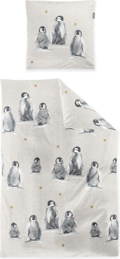 A flat lay of a duvet cover and pillowcase set with a penguin print.