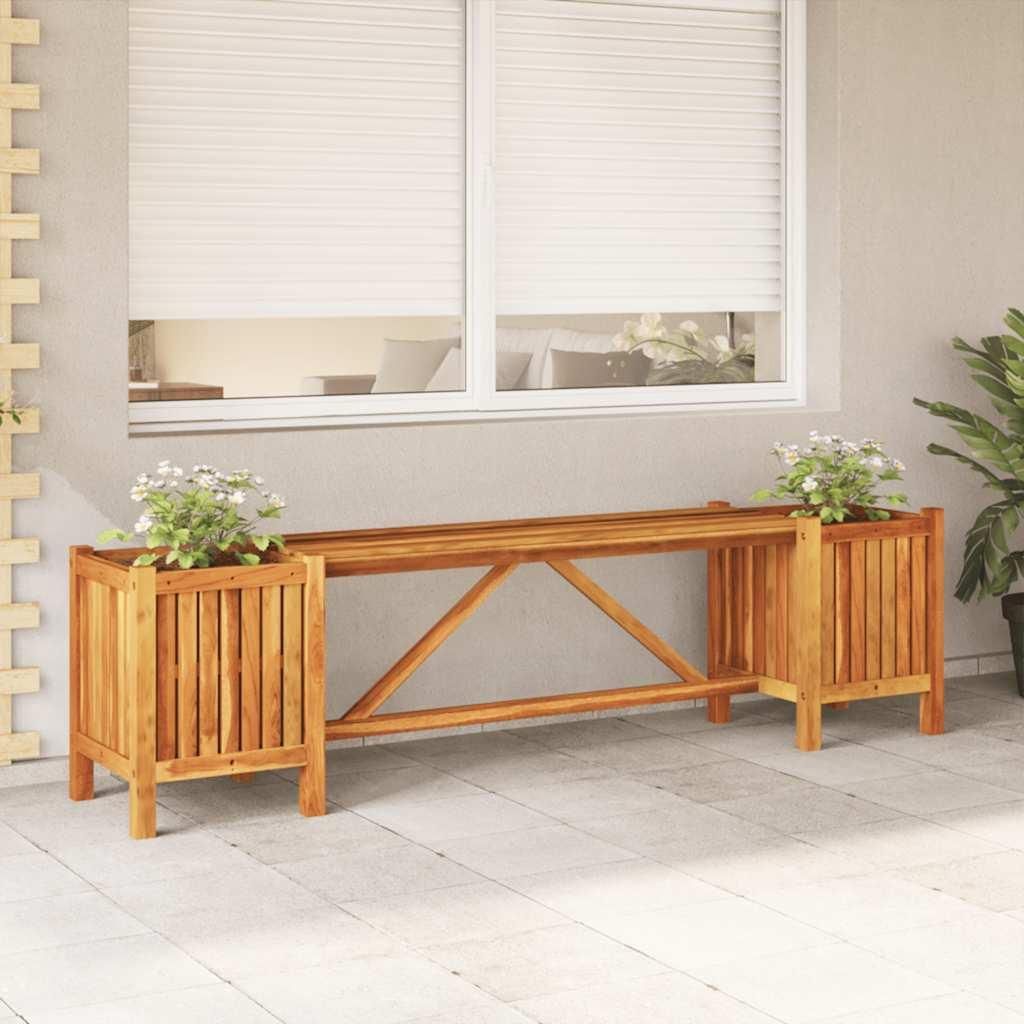 A wooden garden bench with two planter boxes in front of a building with closed blinds.