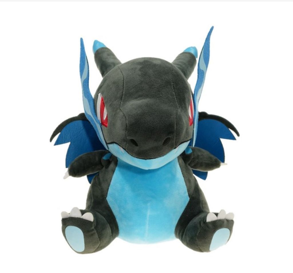 A plush toy of a dragon-like creature, likely a Pokemon character, is shown sitting against a white background.