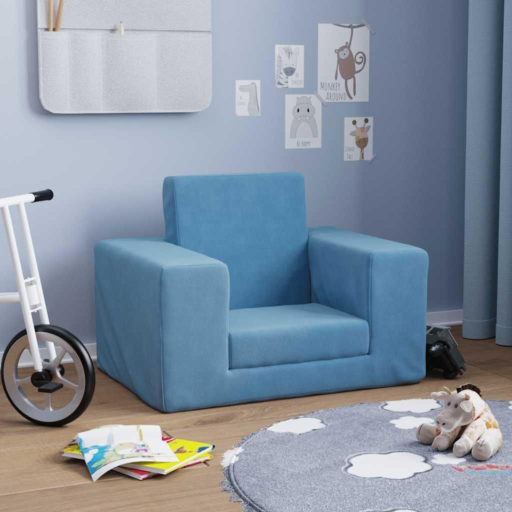 A child's bedroom with a blue sofa, toys, and decorations.