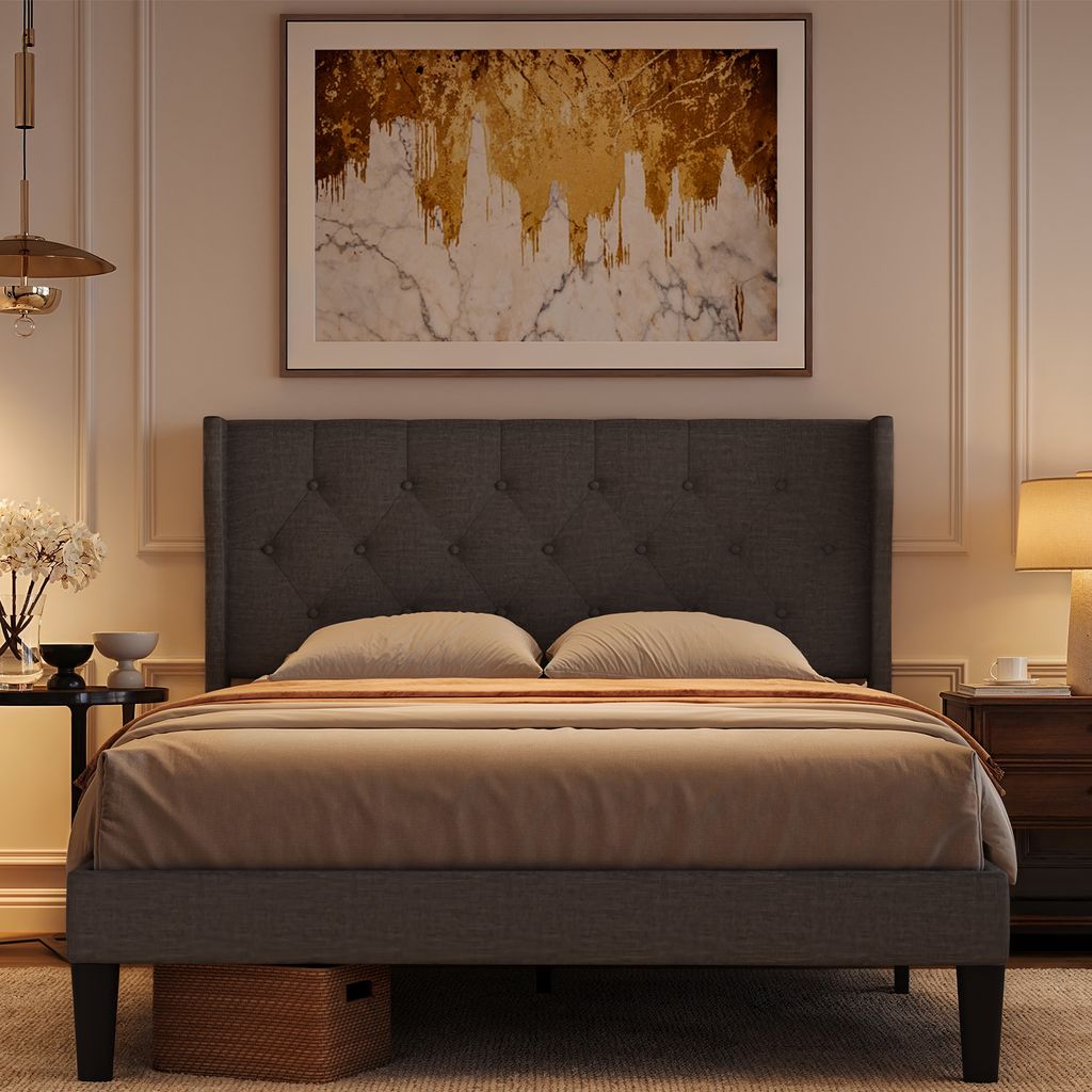 A bedroom scene with a bed, a nightstand, and a painting on the wall.