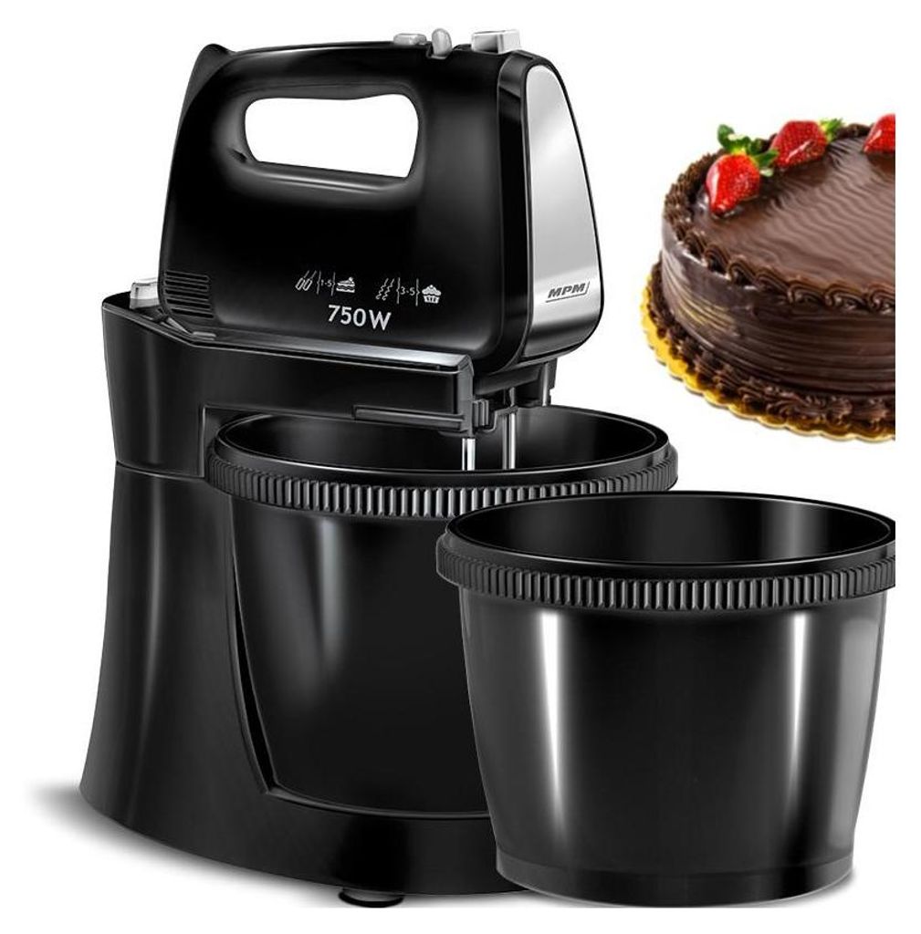 A black hand mixer with two bowls and a chocolate cake are shown.