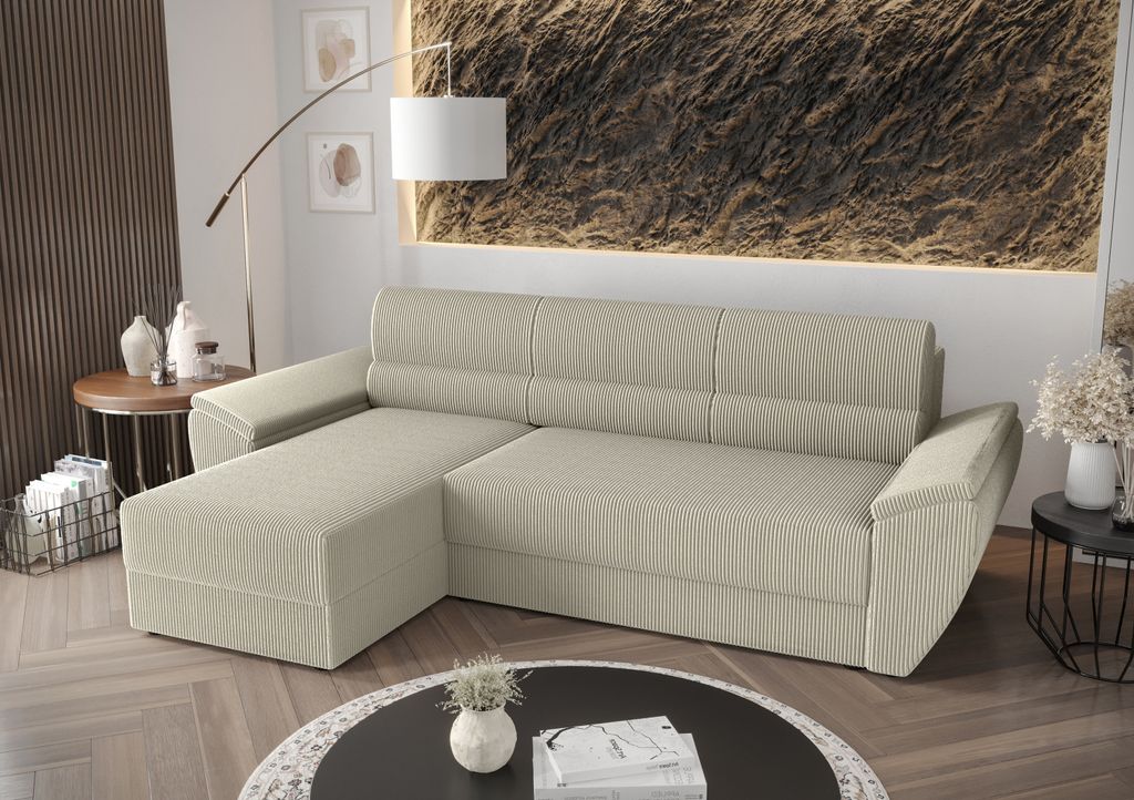 A beige sectional sofa with a chaise lounge is shown in a living room setting.
