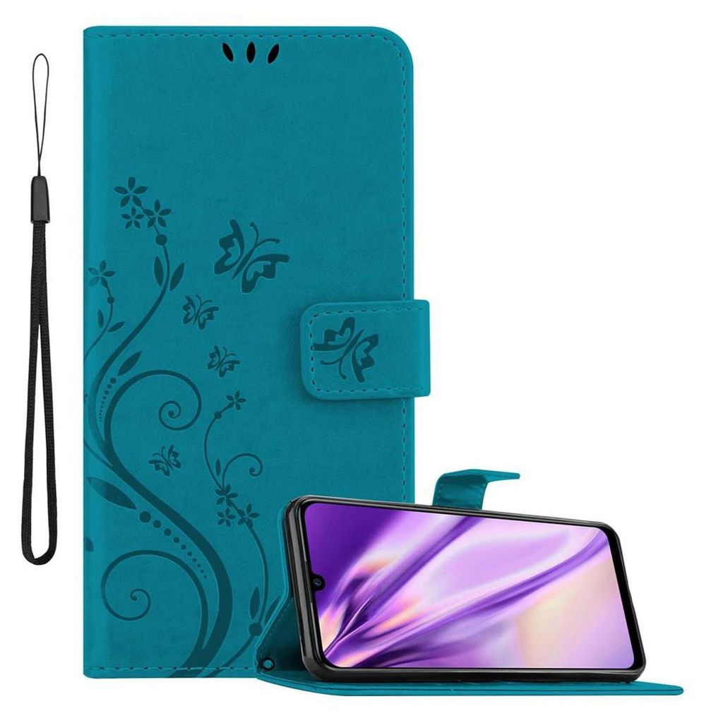 A teal flip phone case with a floral and butterfly design is shown open, with a smartphone inside.