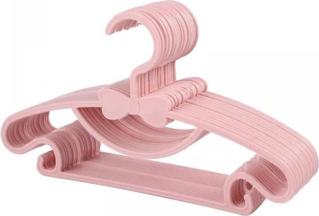 A stack of pink children's hangers with a bow detail.