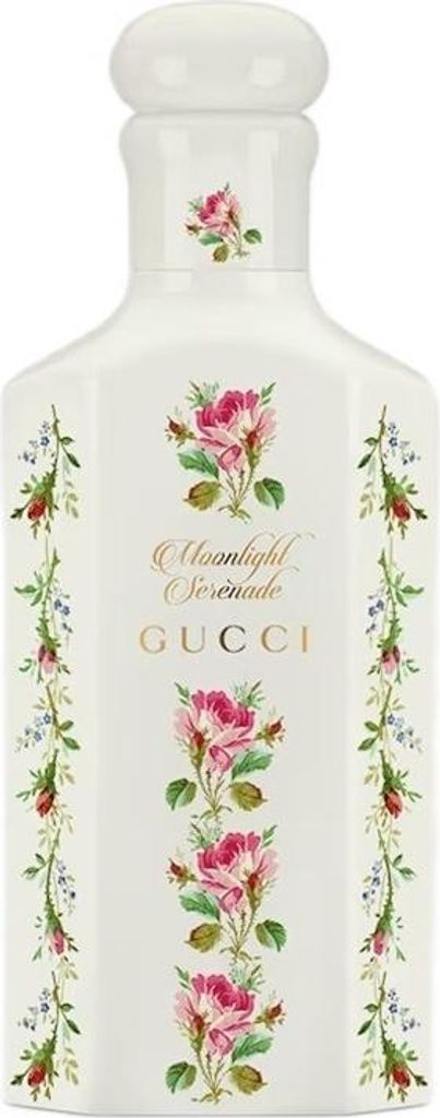 A white bottle of Gucci Moonlight Serenade Eau de Parfum with floral decorations.
