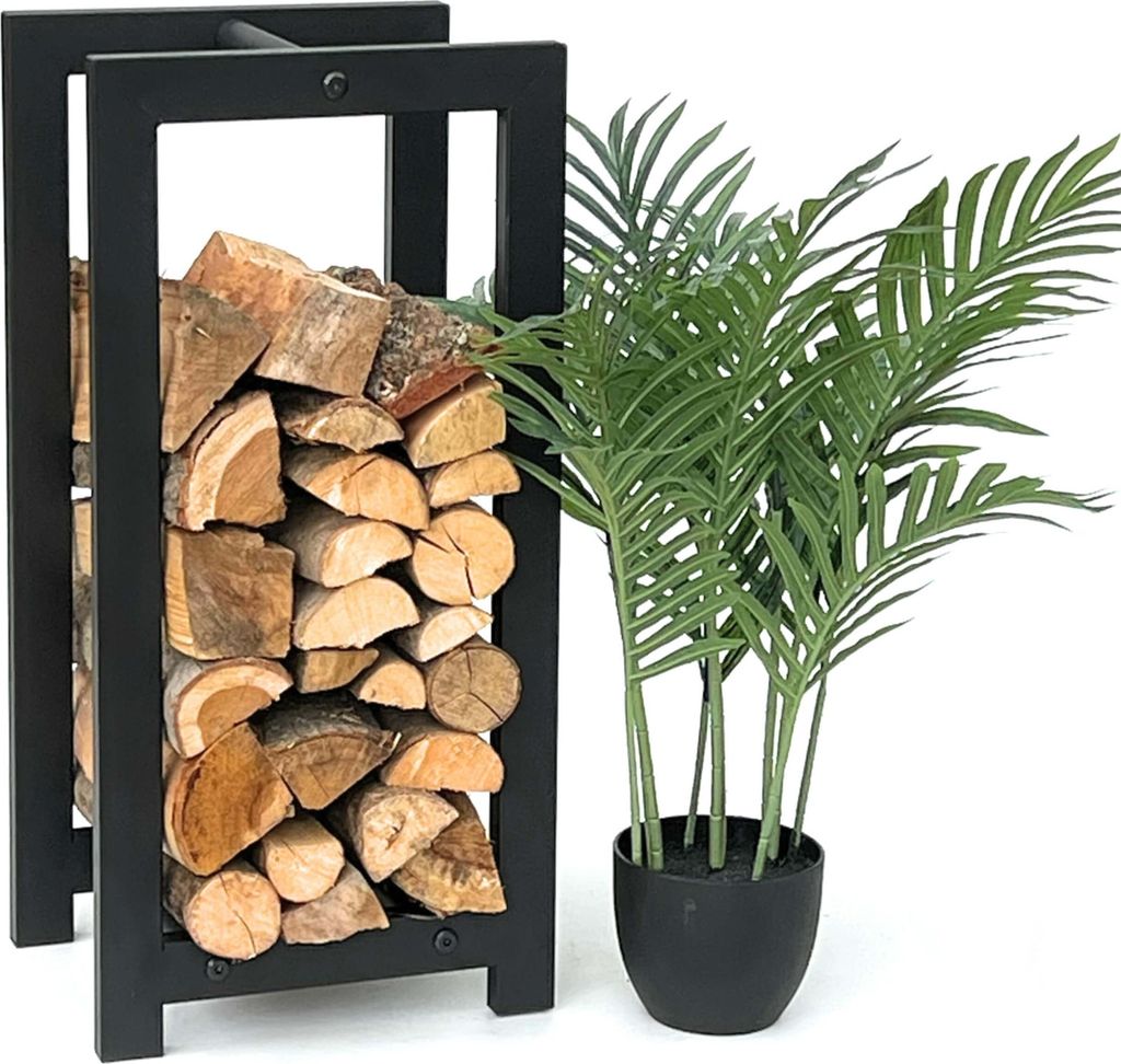 A black metal firewood rack filled with logs next to a potted green plant.