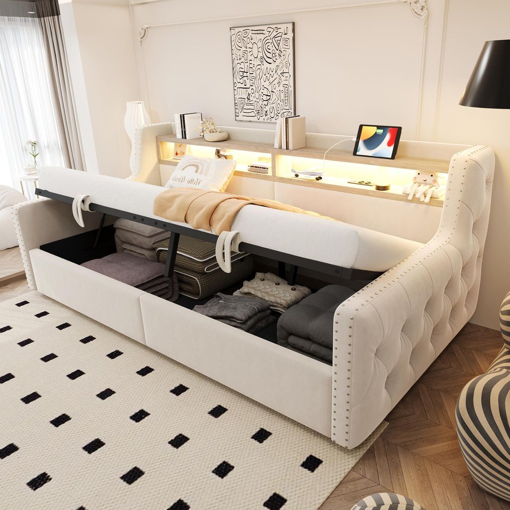 A bedroom scene with a sofa bed open to reveal storage, showcasing its features.