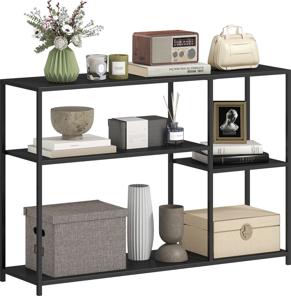 A black metal console table with four shelves, displaying various decorative items.