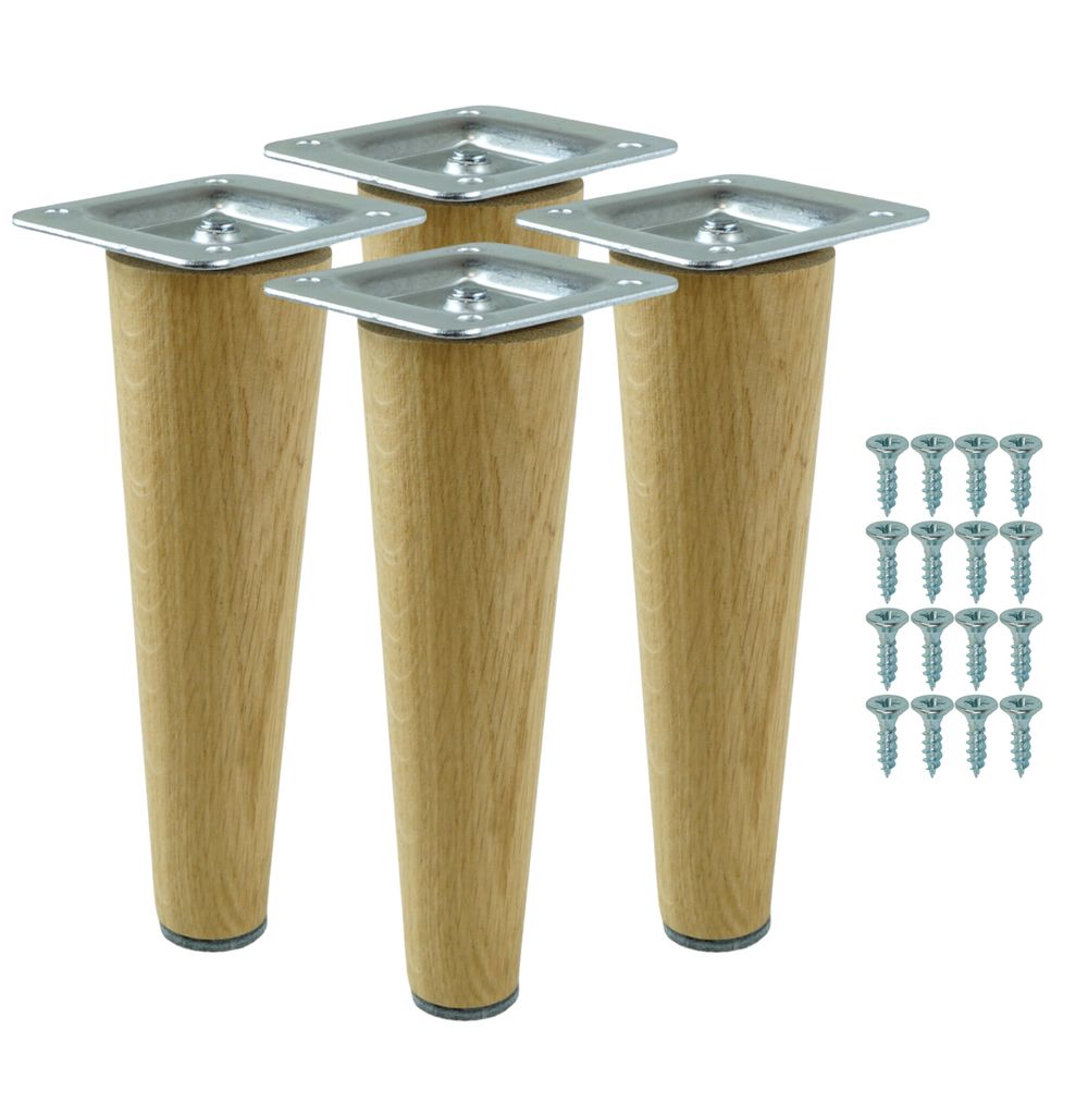 Four wooden furniture legs with metal mounting plates and a set of screws on a white background.