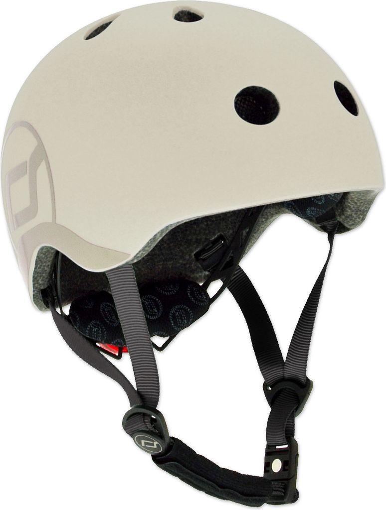 A beige helmet with gray accents and black straps is shown against a white background.
