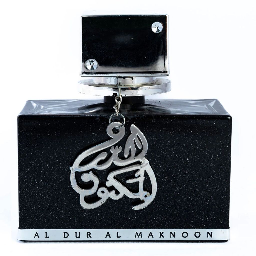 A black perfume bottle with silver Arabic calligraphy and text at the bottom, set against a white background.