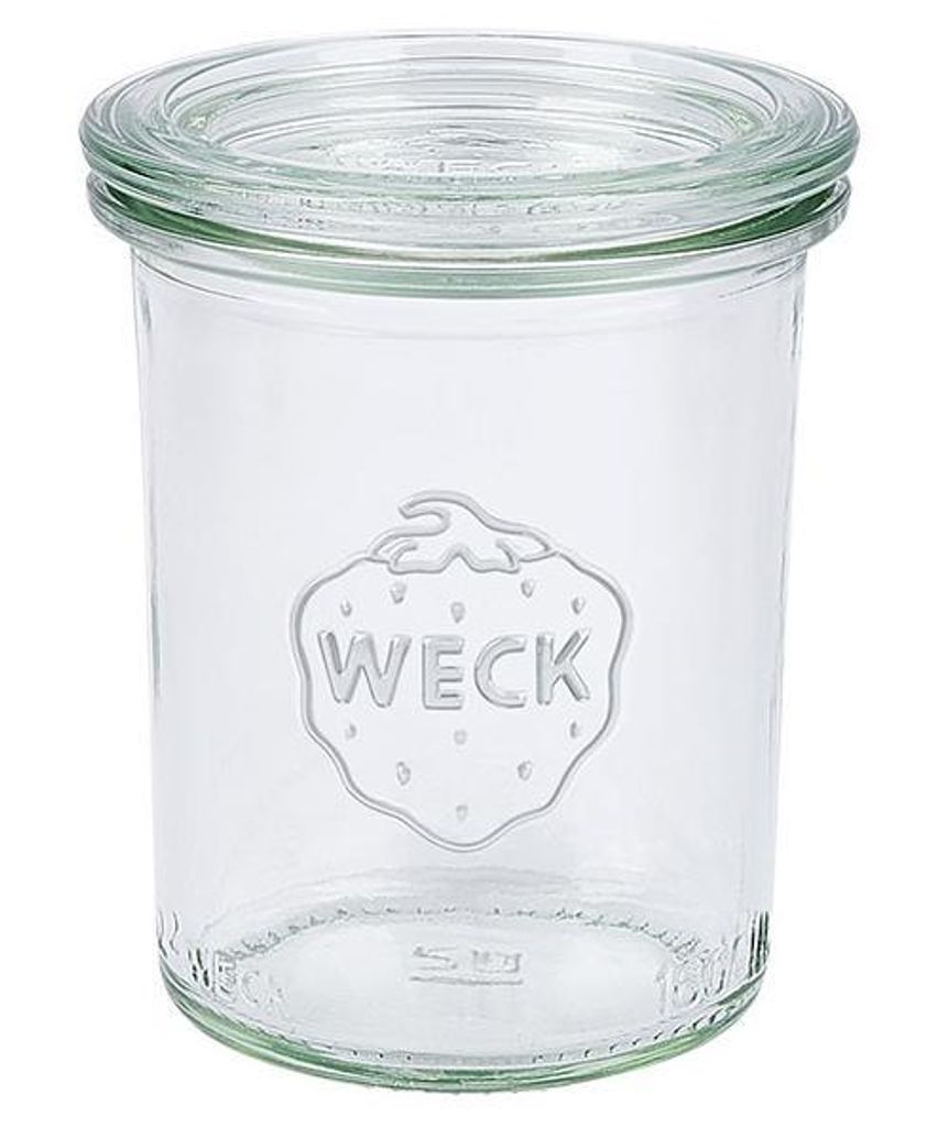 A clear glass jar with a lid, featuring the brand logo embossed on the front.