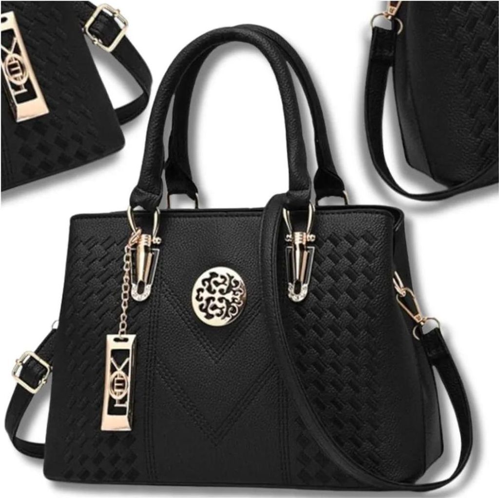 A black women's handbag is displayed against a white background, with a smaller portion of another identical bag visible in the upper left corner.